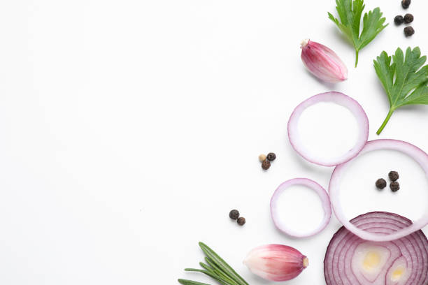 istock Flat lay composition with cut onion and spices on white background 1346683871