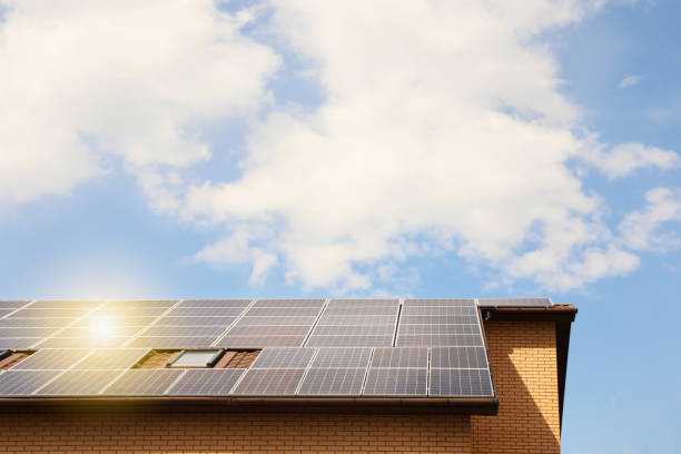 istock Building with installed solar panels on roof. Alternative energy source 1346683912