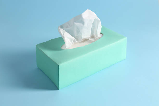 istock Box of paper tissues on light blue background 1346684091