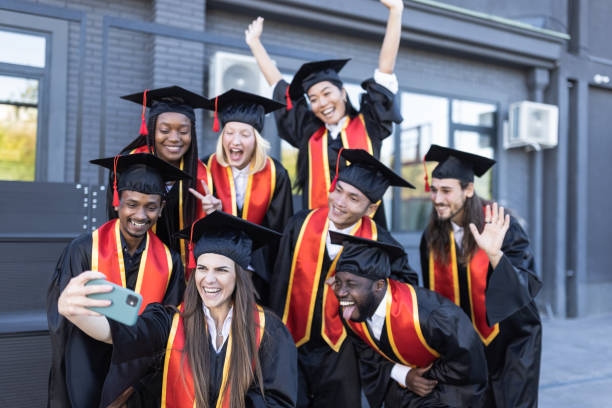 istock University students taking selfie just before the Graduation ceremony 1346684197