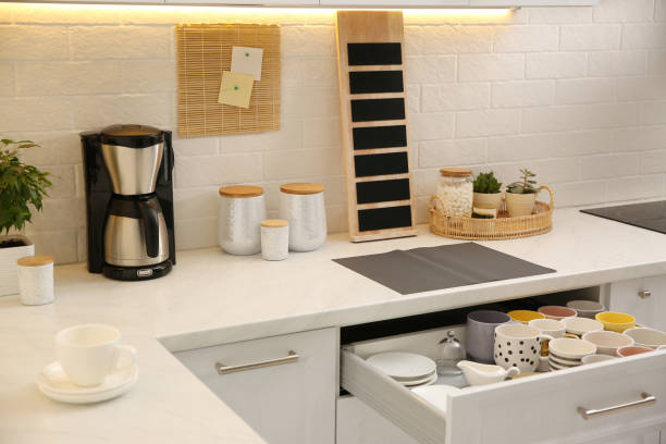 istock Stylish kitchen interior with modern coffeemaker on countertop 1346685041