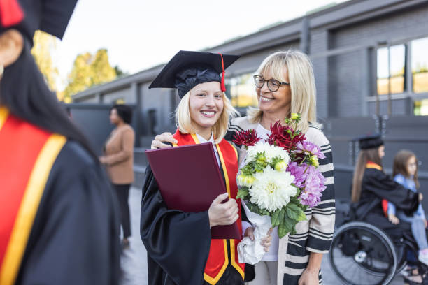 istock Female graduate with Mother 1346686861