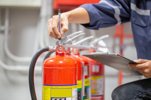 istock Engineer are checking and inspection a fire extinguishers tank in the fire control room for safety training and fire prevention. 1346687729