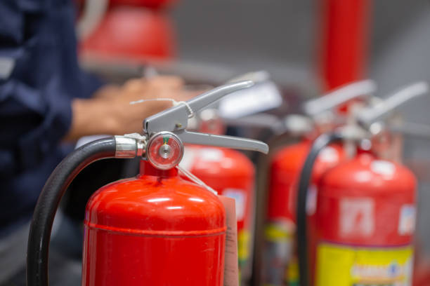 istock Engineer are checking and inspection a fire extinguishers tank in the fire control room for safety training and fire prevention. 1346687730