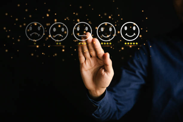 istock Customer service and Satisfaction concept ,Businessman are touching the virtual screen on the happy Smiley face icon to give satisfaction in service. 5-star rating very impressed. 1346687995
