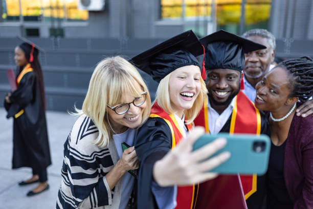 istock Students after graduation ceremony with their family 1346690719