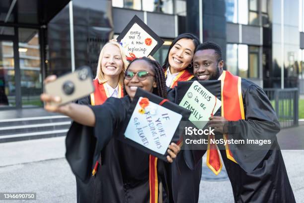 Students After Graduation Ceremony Taking Selfie Stock Photo - Download Image Now - Mortarboard, Graduation, University