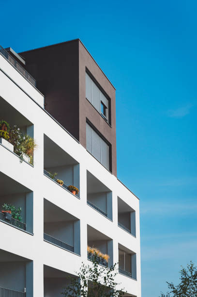 istock Modern residential building with greenery on balconies 1346690820