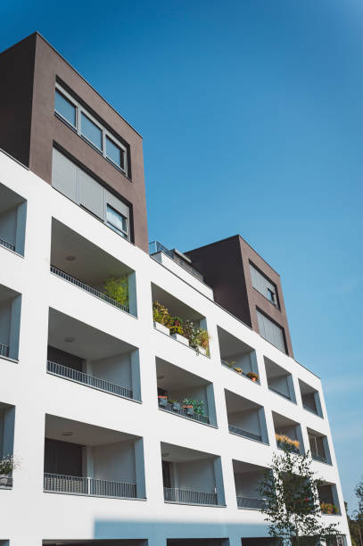 istock Modern residential building with greenery on balconies 1346690823