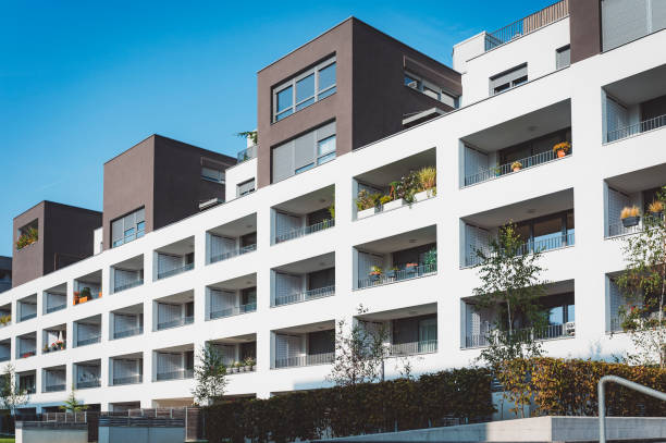 istock Modern residential building with greenery on balconies 1346690826