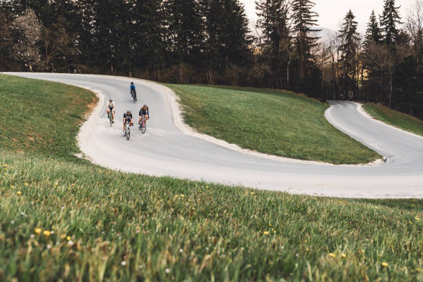istock Group of cyclist descending down a curvy road 1346690923