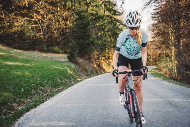 istock Woman cyclist on the road 1346690924