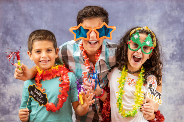 istock Three kids celebrating new years Eve. 1346691881