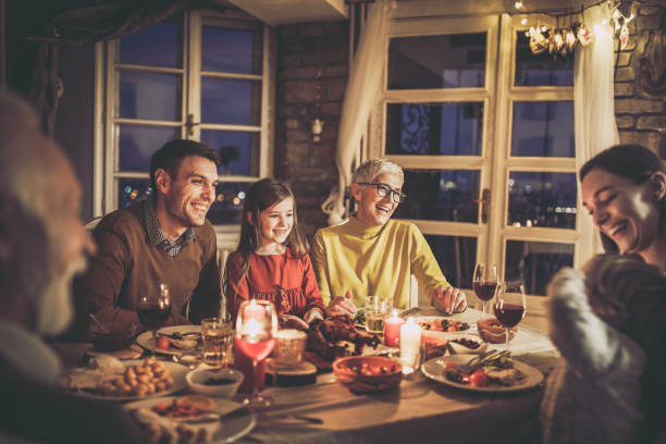 istock Cheerful multi-generation family talking during dinner at home. 1346694147