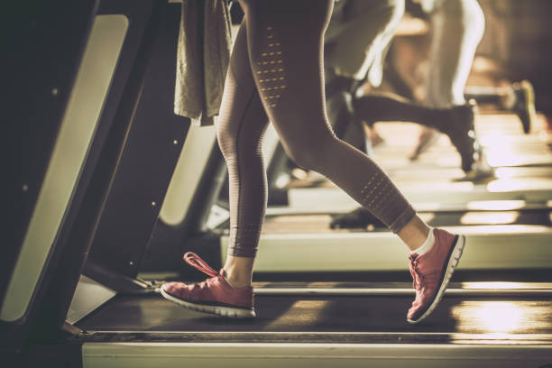 istock Unrecognizable athlete exercising on treadmill in a gym. 1346695764