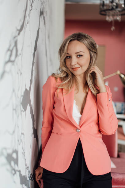 istock a young beautiful girl in a pink jacket 1346696898