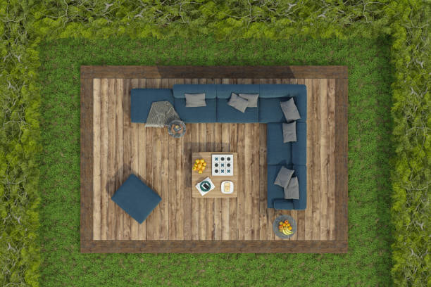 istock High angle view of a garden with sofa on a wooden deck floor on grass 1346697689