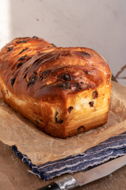 istock Brioche with chocolate chips on wooden background 1346700836