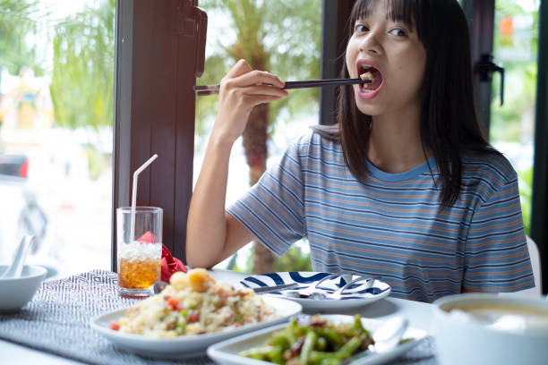 A girl is having a delicious meal at a restaurant.