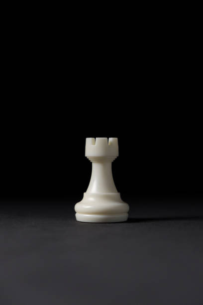 isolated white rook chess piece on black background isolated white rook chess piece on black background chess rook stock pictures, royalty-free photos & images