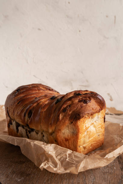 istock Brioche with chocolate chips on wooden background 1346701212