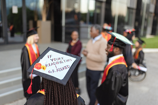 University students with their personalized mortarboards