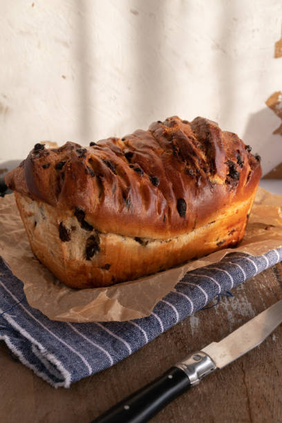 istock Brioche with chocolate chips on wooden background 1346702004