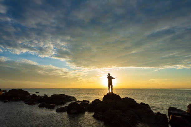 istock Silhouette fisherman 1346702263