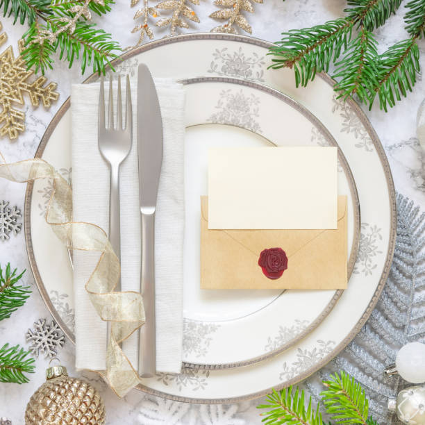 istock Festive table setting with Christmas decorations. Card and envelope mockup 1346703895