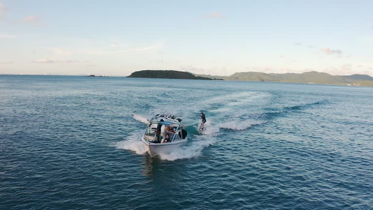 LGBTQIA person wakeboarding on holiday.