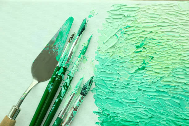 istock Abstract colorful artwork and brushes, top view 1346704718