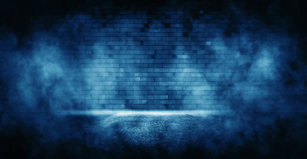 istock Rays neon light in the dark with  smoke. Empty background scene  spotlight. 1346705206