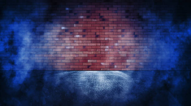 istock Rays neon light on neon brick wall. Empty scene. Neon reflections on wet asphalt. Cyberpunk background with copy space. 1346705207