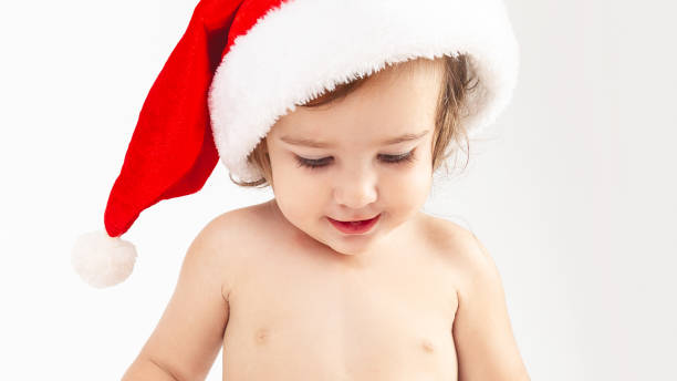 istock Cute little baby in Santa hat on white background 1346706576