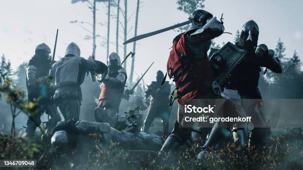 Epic Armies Of Medieval Knights On Battlefield Clash Plate Body Armored Warriors Fighting Swords In Battle Bloody War And Savage Conquest Historical Reenactment Cinematic Shot Stock Photo - Download Image Now