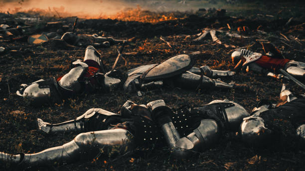 After Epic Battle Bodies of Dead, Massacred Medieval Knights Lying on Battlefield. Warrior Soldiers Fallen in Conflict, War, Conquest, Warfare, Colonization. Cinematic Dramatic Historical Reenactment After Epic Battle Bodies of Dead, Massacred Medieval Knights Lying on Battlefield. Warrior Soldiers Fallen in Conflict, War, Conquest, Warfare, Colonization. Cinematic Dramatic Historical Reenactment Massacre stock pictures, royalty-free photos & images