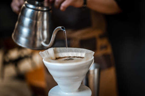 close up of hand brewing coffee - caffeine free imagens e fotografias de stock