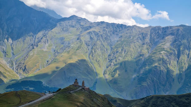 istock Gergeti Glacier - Distant view on Gergeti Trinity Church in Stepansminda, Georgia. The church is located on a high Caucasus 1346714788