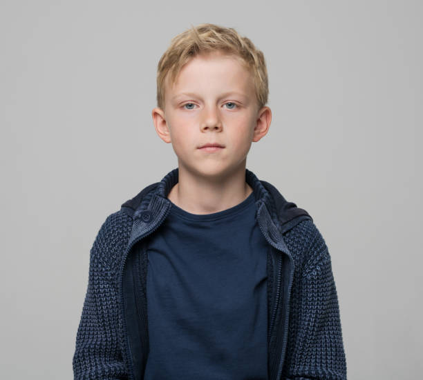 Close-up of boy wearing blue jacket