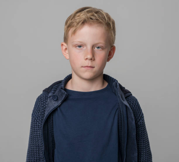 istock Close-up of boy wearing blue jacket 1346716792