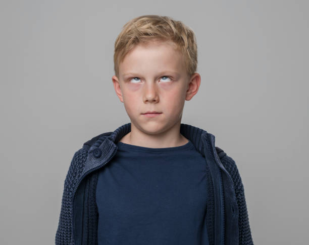 istock Close-up of boy making funny face 1346716794