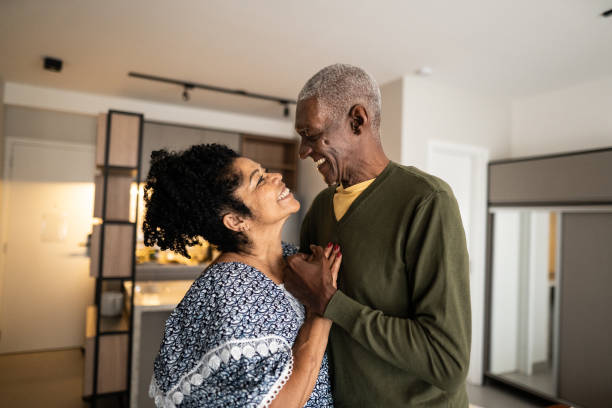 istock Senior couple looking at each other at home 1346718999