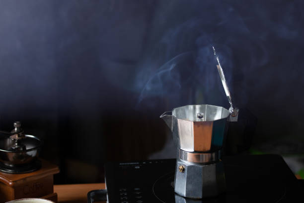 istock Moka Pot for making coffee and smoke for fresh coffee 1346719197