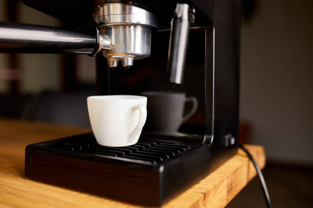 istock Coffee Maker Ready To Preparing A Coffee. Cup Of Coffee Being Prepared Using An Espresso Machine In A Cafe. 1346721611