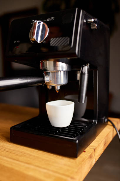 istock Coffee Maker Ready To Preparing A Coffee. Cup Of Coffee Being Prepared Using An Espresso Machine In A Cafe. 1346721614