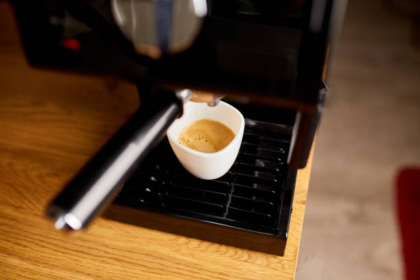 istock Cup Of Coffee Being Prepared Using An Espresso Machine In A Cafe, Coffee Machine Making Espresso Coffee 1346721621