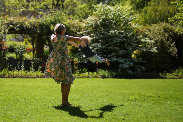 istock A mother swings her boy around 1346724764