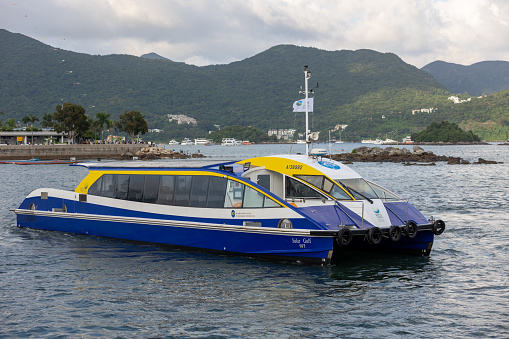 Hong Kong - October 3, 2021 : Solar Sailor Ferry at Sai Kung Pier, New Territories, Hong Kong. A scheduled ferry service connects Sai Kung Town and the ferry pier of The Jockey Club Kau Sai Chau Public Golf Course.