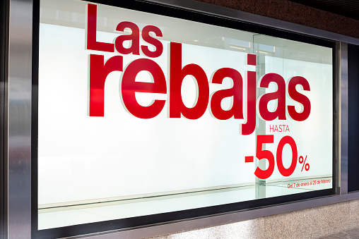 A display window advertising reduced prices in a shop during winter sales on January 20202 in Alicante, Spain, Europe