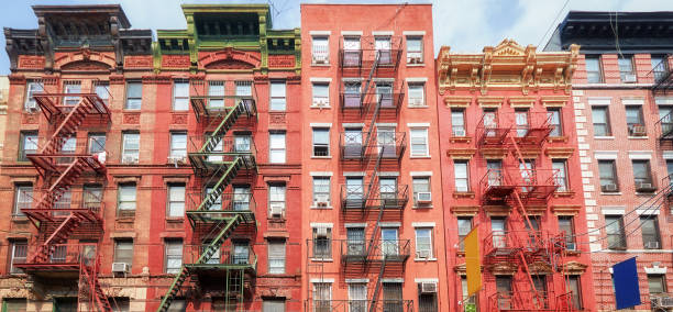 istock New York townhouses with fire escape, selective focus, US. 1346728227